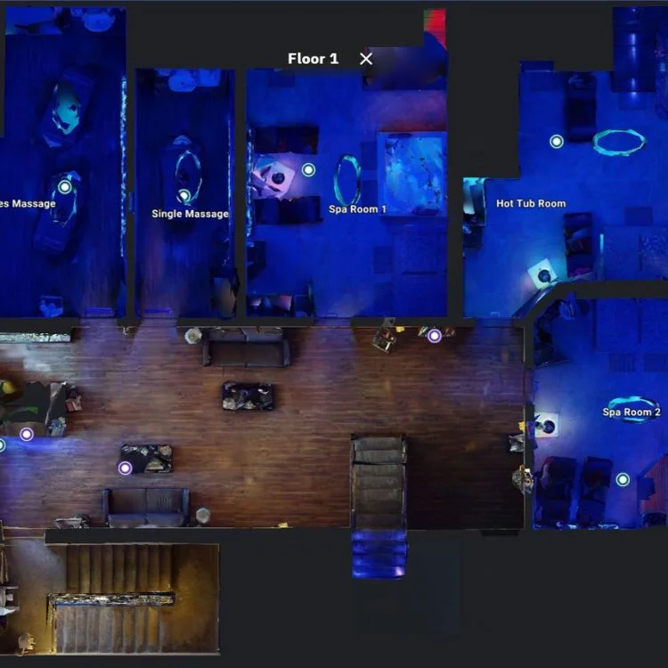 Interactive floor plan of Unique Day Spa showing massage rooms, spa rooms, and hot tub areas captured in the virtual tour.