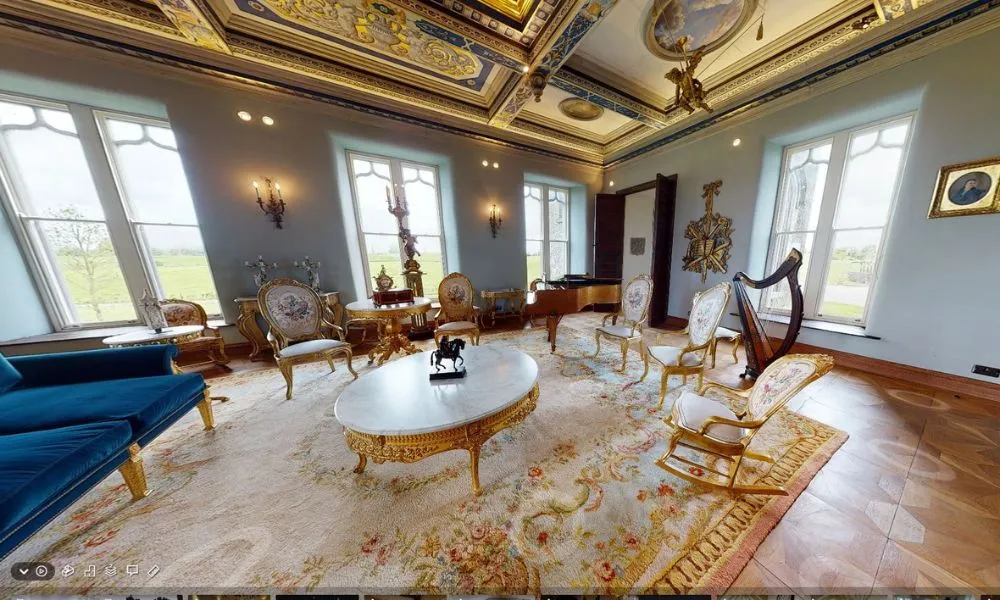 Virtual tour of Killua Castle showcasing the elegant drawing room with ornate furniture, a grand ceiling design, and stunning natural light.