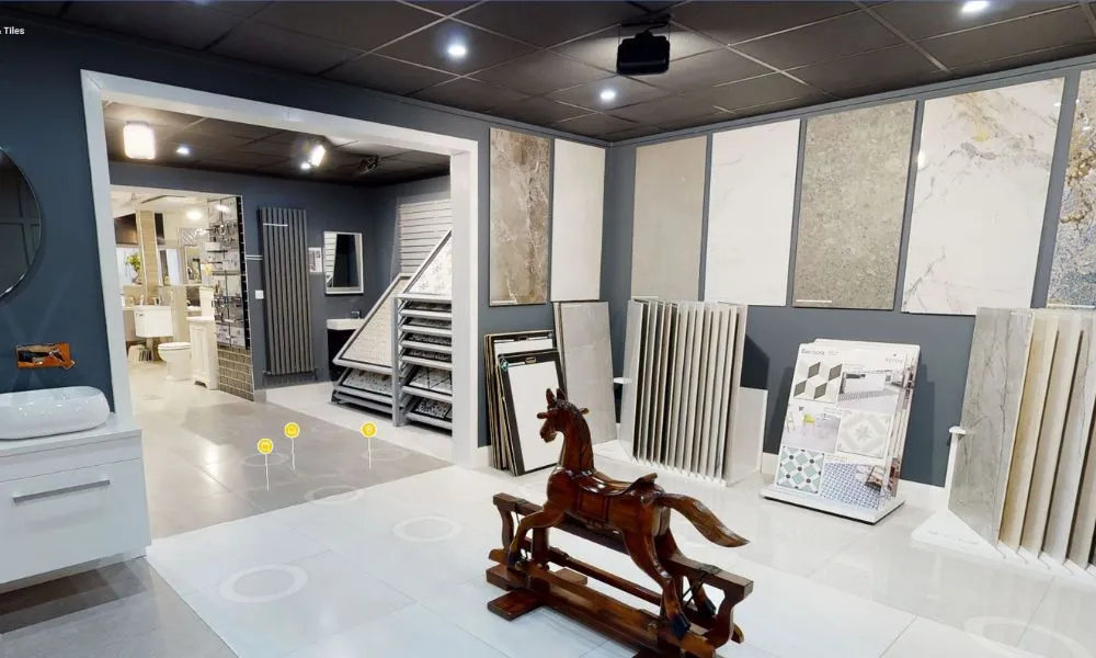 Interior view of Lakeshore Bathrooms & Tiles Showroom virtual tour, featuring a display of premium tiles, bathroom fixtures, and a decorative wooden rocking horse.