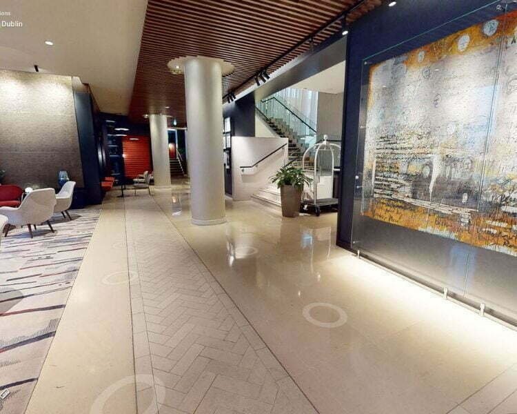 Interior view of The Morrison Hotel lobby captured during the 3D tour, showcasing its modern design, vibrant artwork, and elegant seating area.