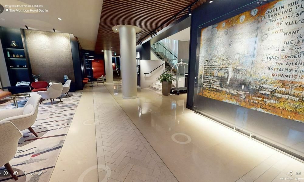 Interior view of The Morrison Hotel lobby captured during the 3D tour, showcasing its modern design, vibrant artwork, and elegant seating area.