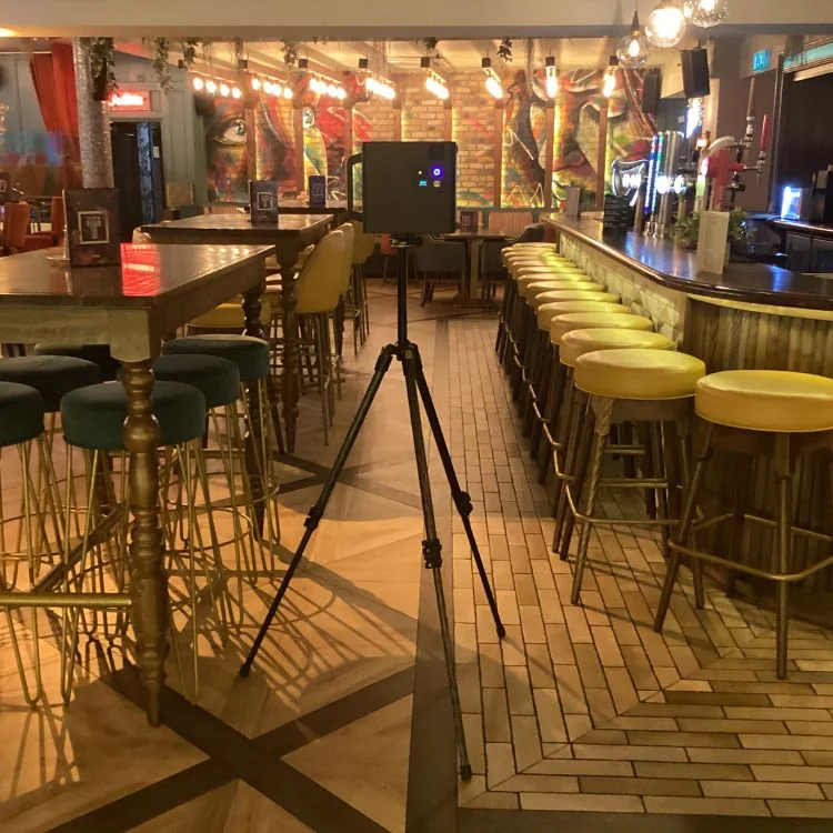 Matterport camera capturing the vibrant interior of Town Leixlip, highlighting its colorful bar design and modern seating arrangement.